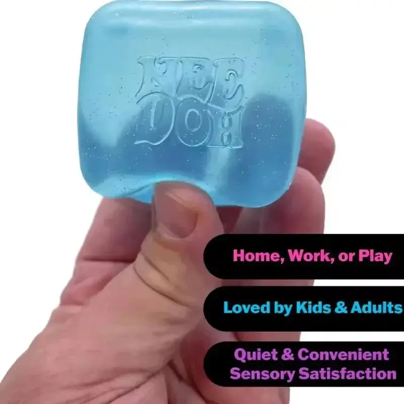 Nice Cube Stress Toy light-blue cube held close-up, embossed NEE DOH logo